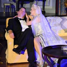 Charles and Elvira sitting on couch