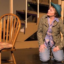 Ginny Racette acting on stage during a performance of On Golden Pond